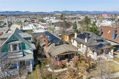 an aerial view of a house with a lake view