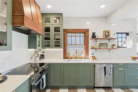 a kitchen with a sink stove and cabinets