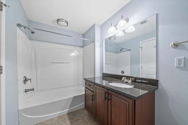 a bathroom with a double vanity sink mirror and double