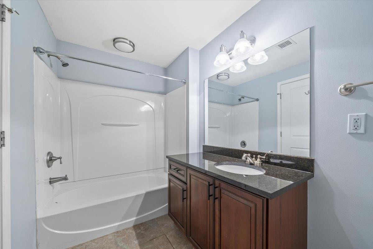 665 Tennessee Street, Unit 301 Memphis, TN 38103 - Photo 28 of 38 a bathroom with a double vanity sink mirror and double