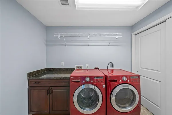a utility room with dryer and washer