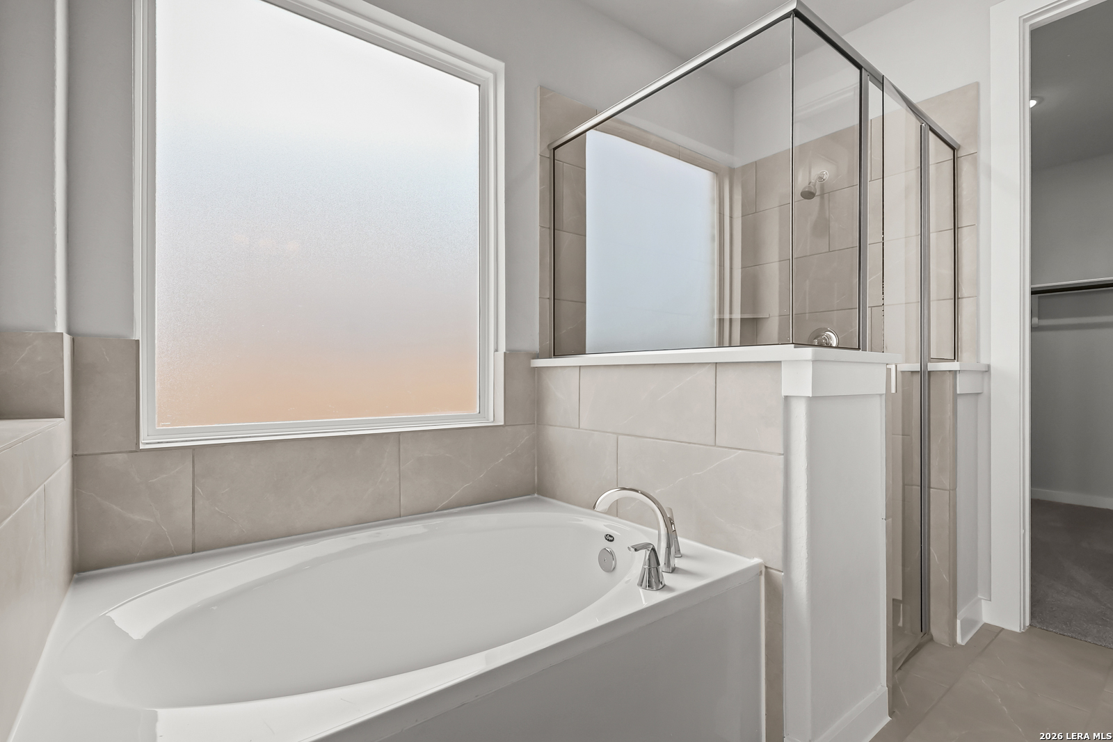 165 Mallorys Way Castroville, TX 78009 - Photo 18 of 34 a white bath tub sitting next to a shower