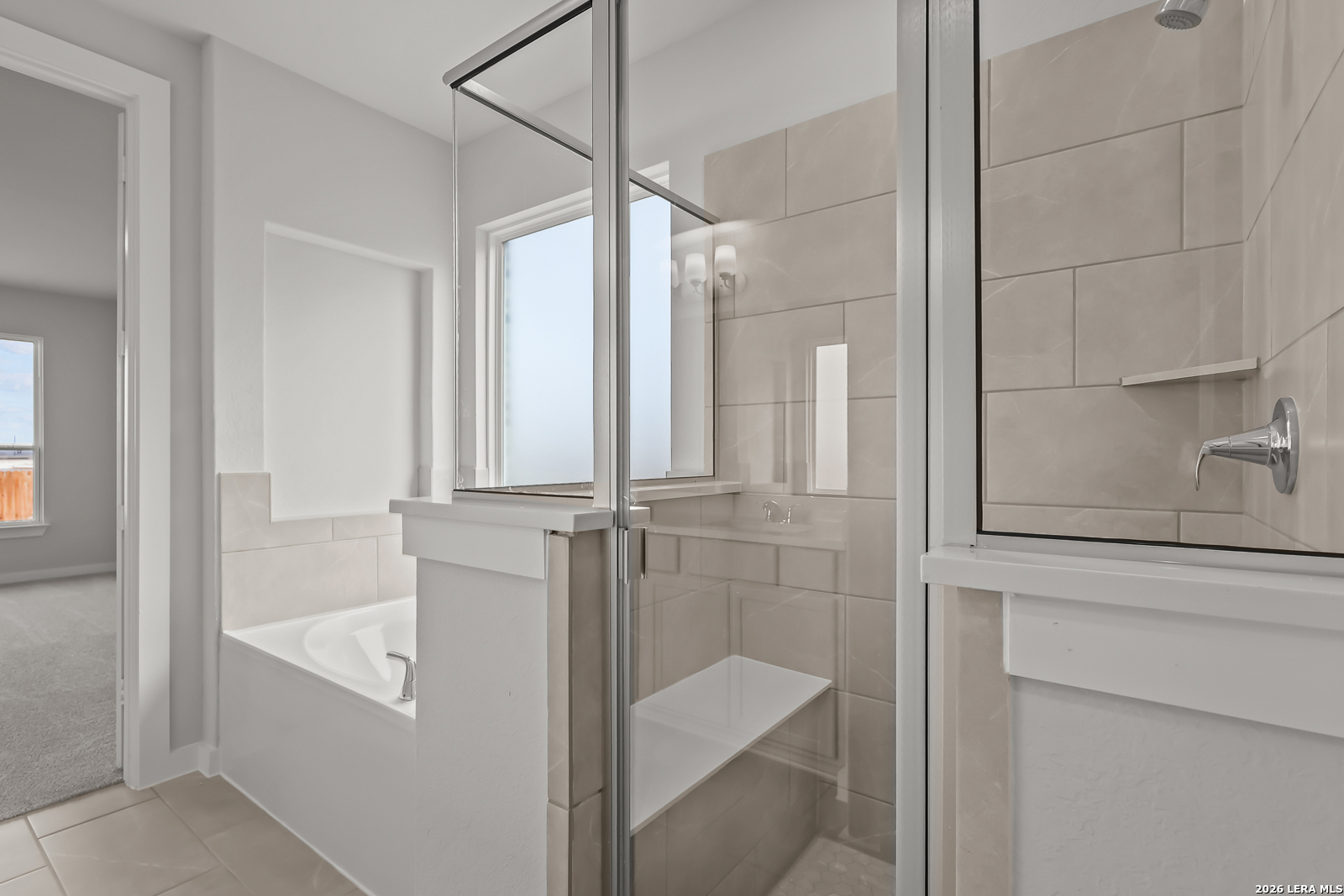 165 Mallorys Way Castroville, TX 78009 - Photo 20 of 34 a bathroom with a bathtub and a shower