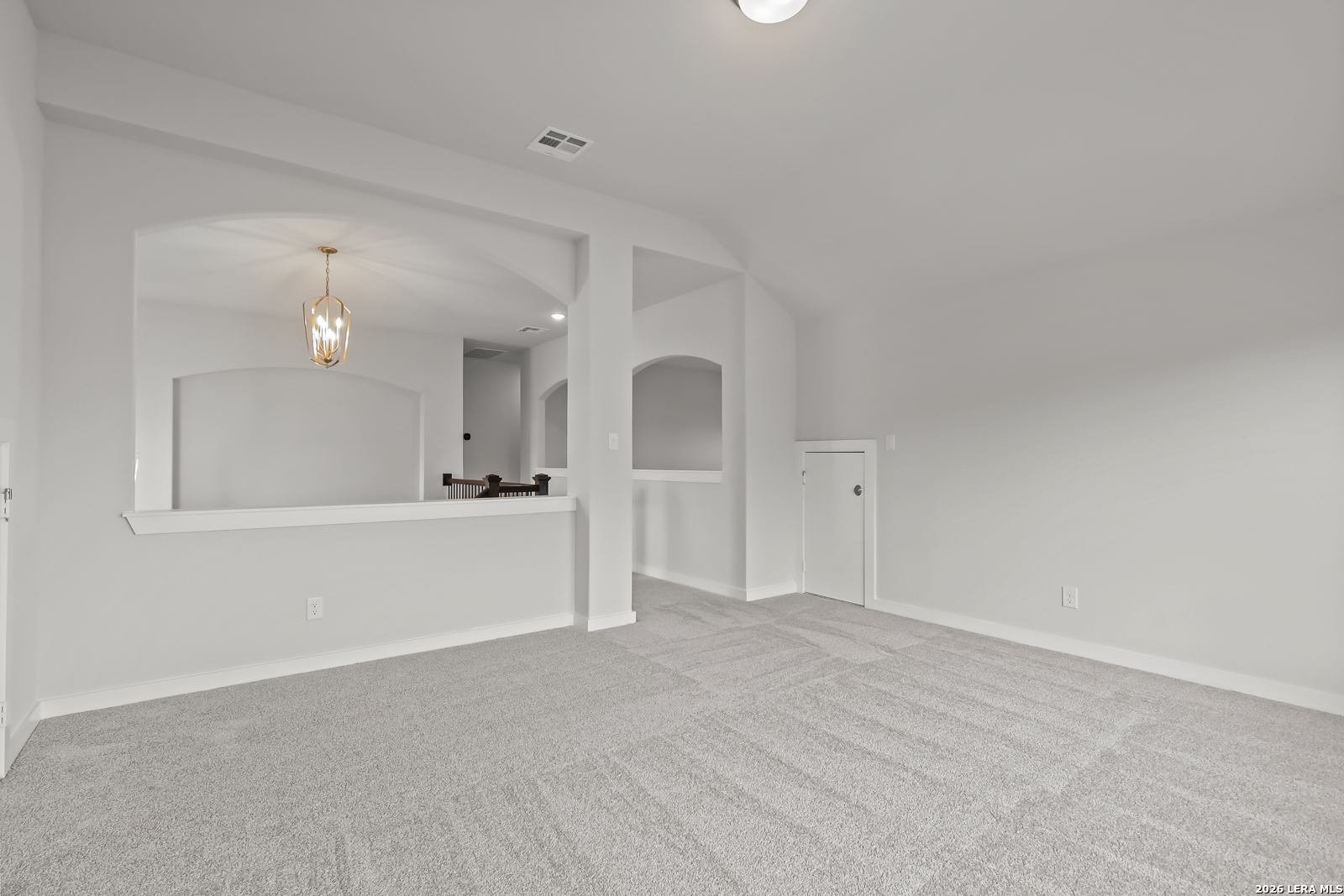 165 Mallorys Way Castroville, TX 78009 - Photo 25 of 34 a view of an empty room with window and wooden floor