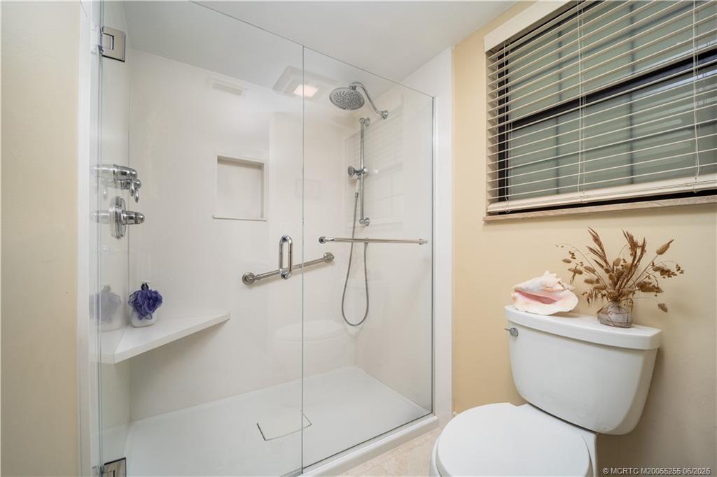 3100 Southeast Pruitt Road, Unit F101 Port St. Lucie, FL 34952 - Photo 22 of 37 Generous walk-in shower & Toto toilet