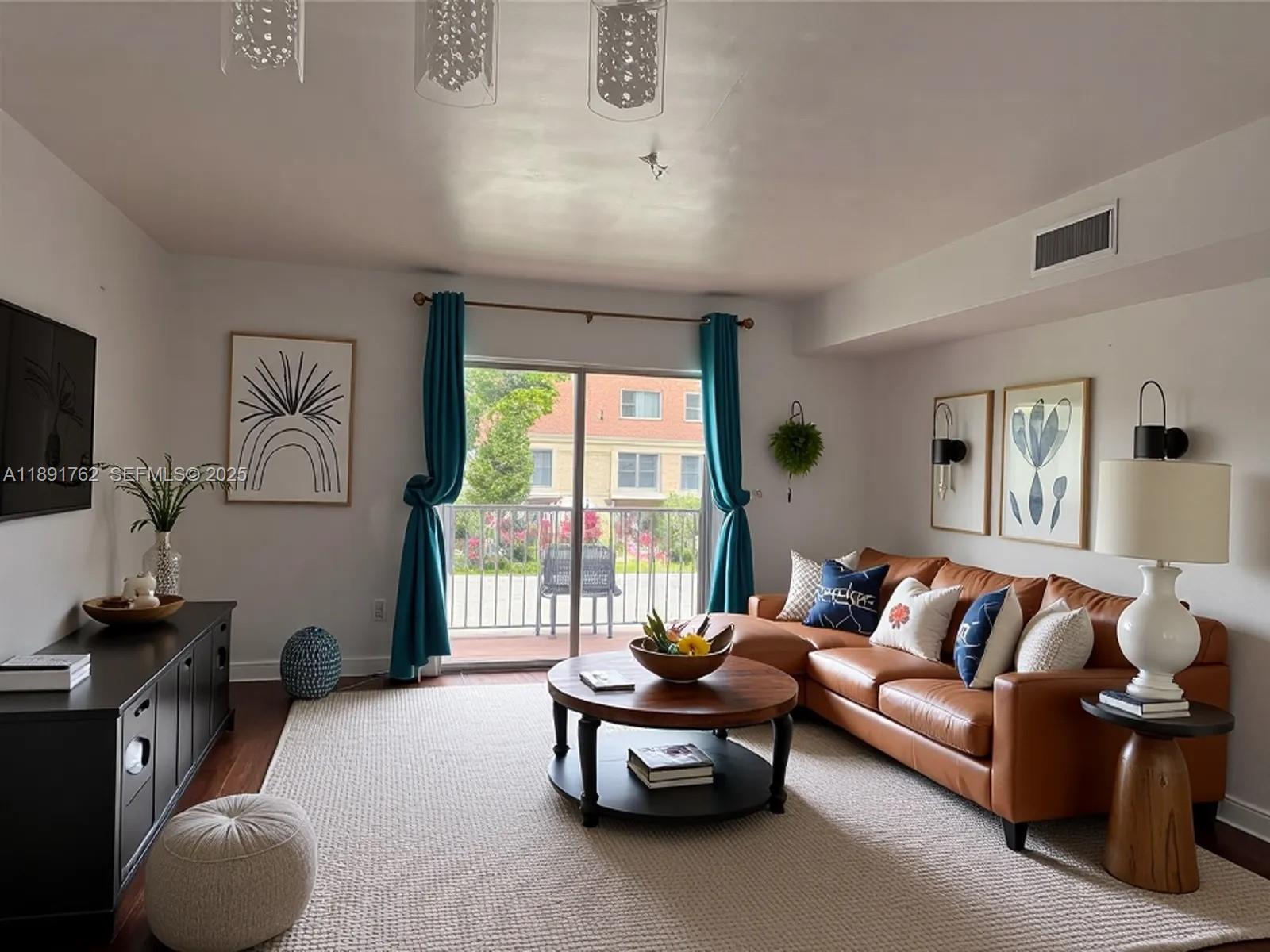 250 Northwest 107th Avenue, Unit 222 Miami, FL 33172 - Photo 6 of 10 a living room with furniture and a flat screen tv