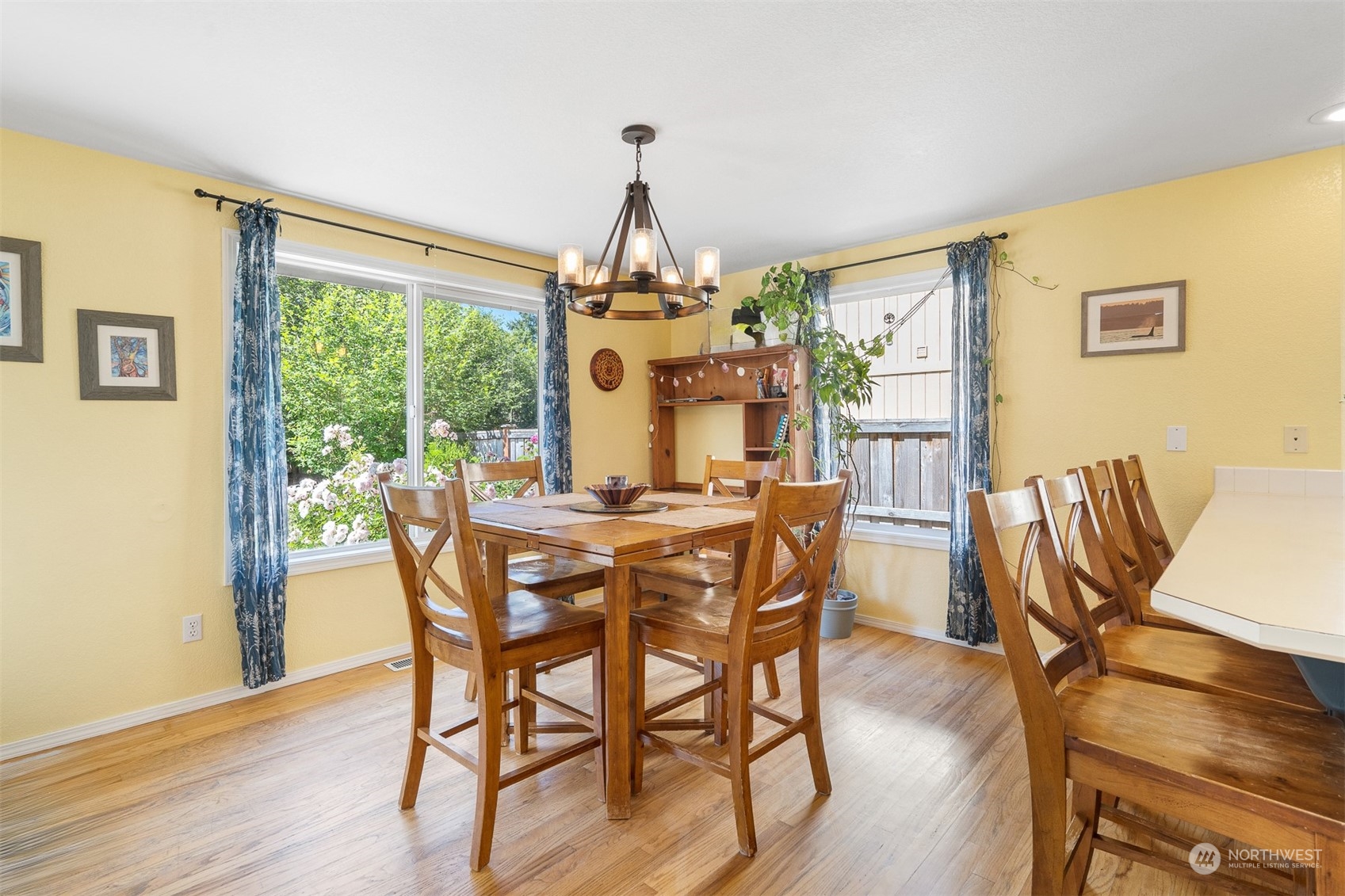 1765 53rd Loop Southeast Olympia, WA 98501 - Photo 16 of 34 a dining room with furniture a chandelier and wooden floor