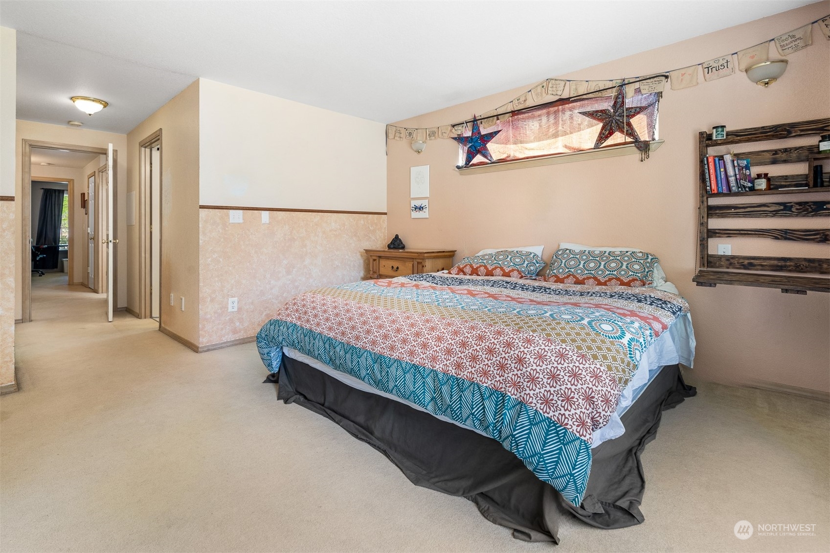1765 53rd Loop Southeast Olympia, WA 98501 - Photo 21 of 34 a bedroom with a bed and cabinets