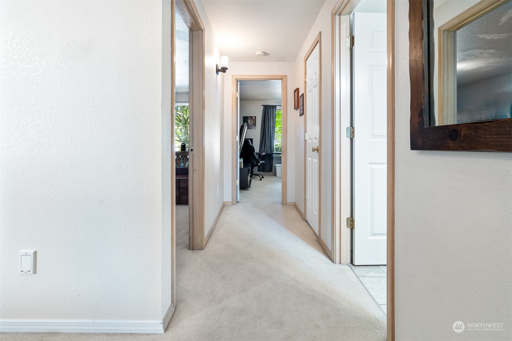 1765 53rd Loop Southeast Olympia, WA 98501 - Photo 23 of 34 a view of a hallway with closet and mirrors