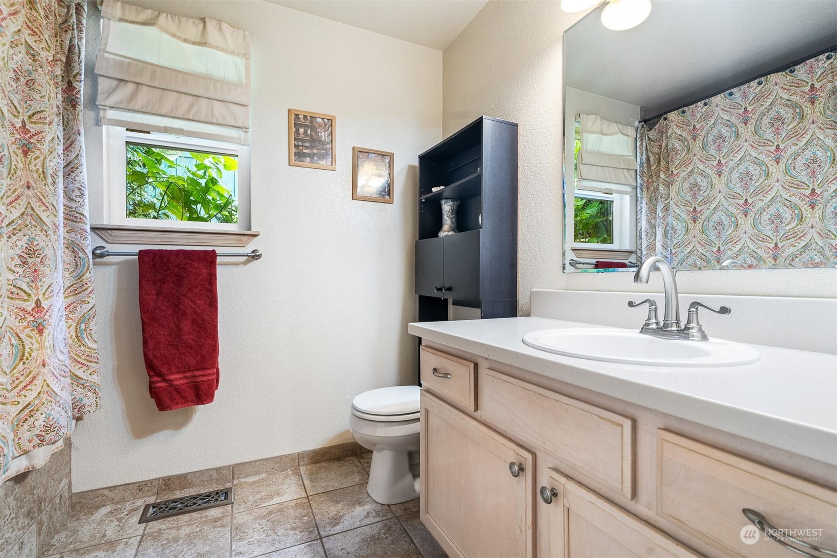 1765 53rd Loop Southeast Olympia, WA 98501 - Photo 25 of 34 a bathroom with a sink toilet and window