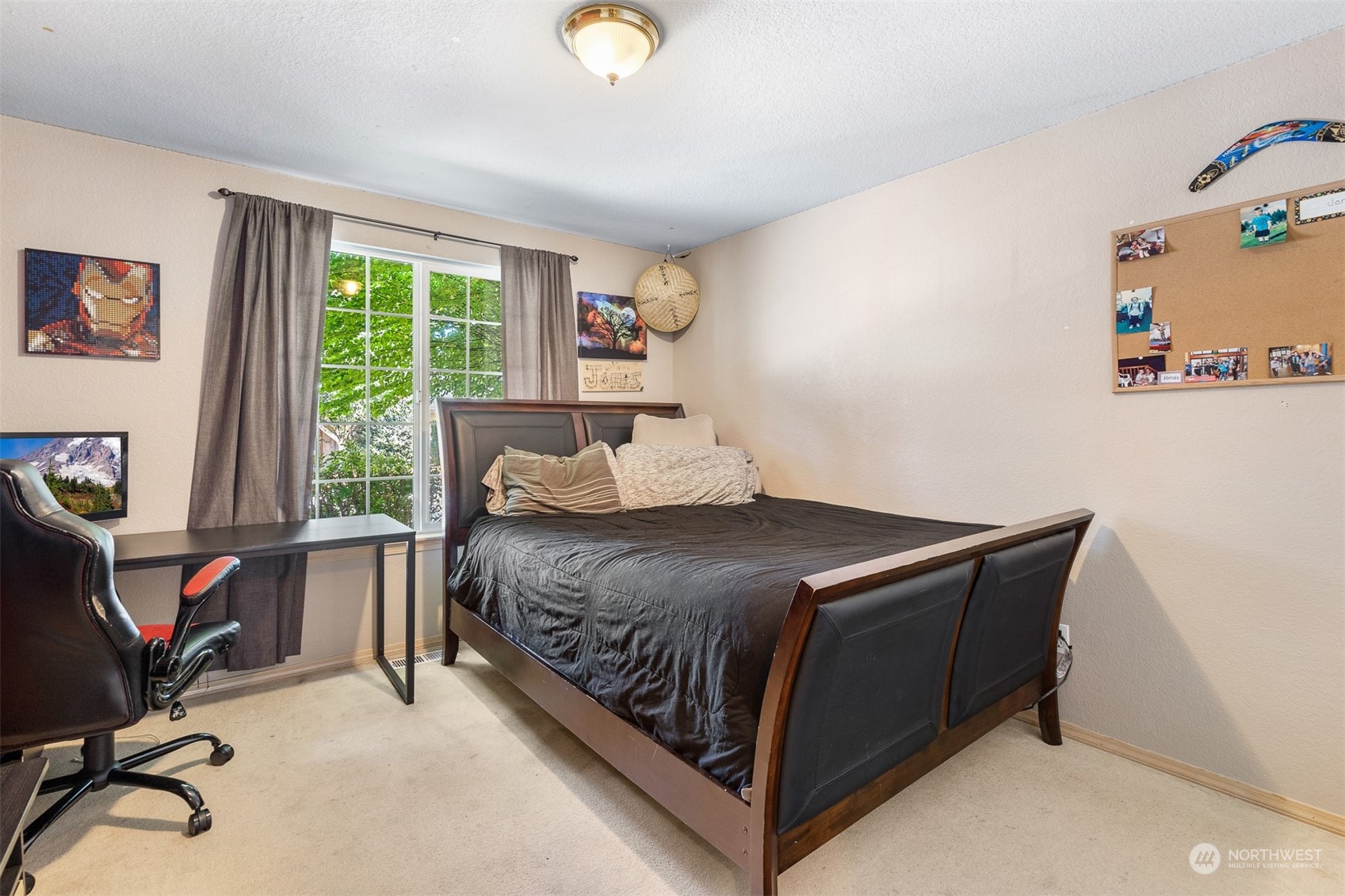 1765 53rd Loop Southeast Olympia, WA 98501 - Photo 27 of 34 a bedroom with a bed chair and a window