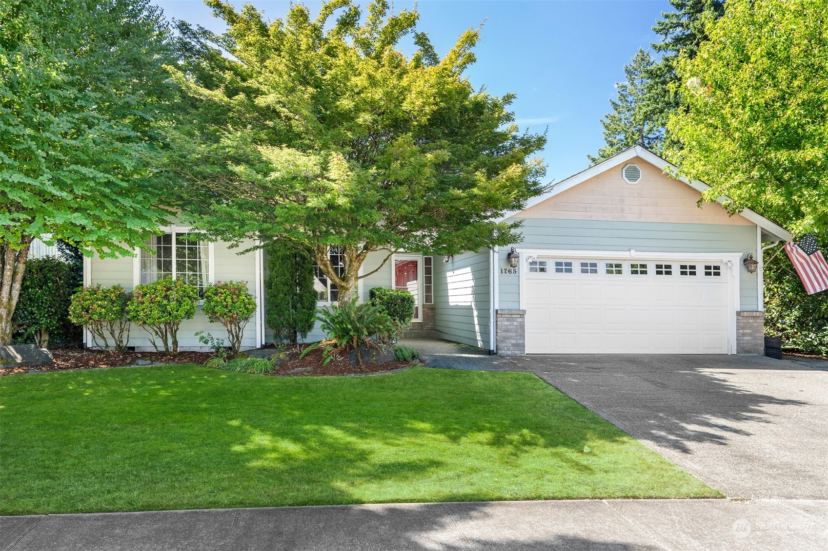 1765 53rd Loop Southeast Olympia, WA 98501 - Photo 30 of 34 a front view of a house with a yard and garage