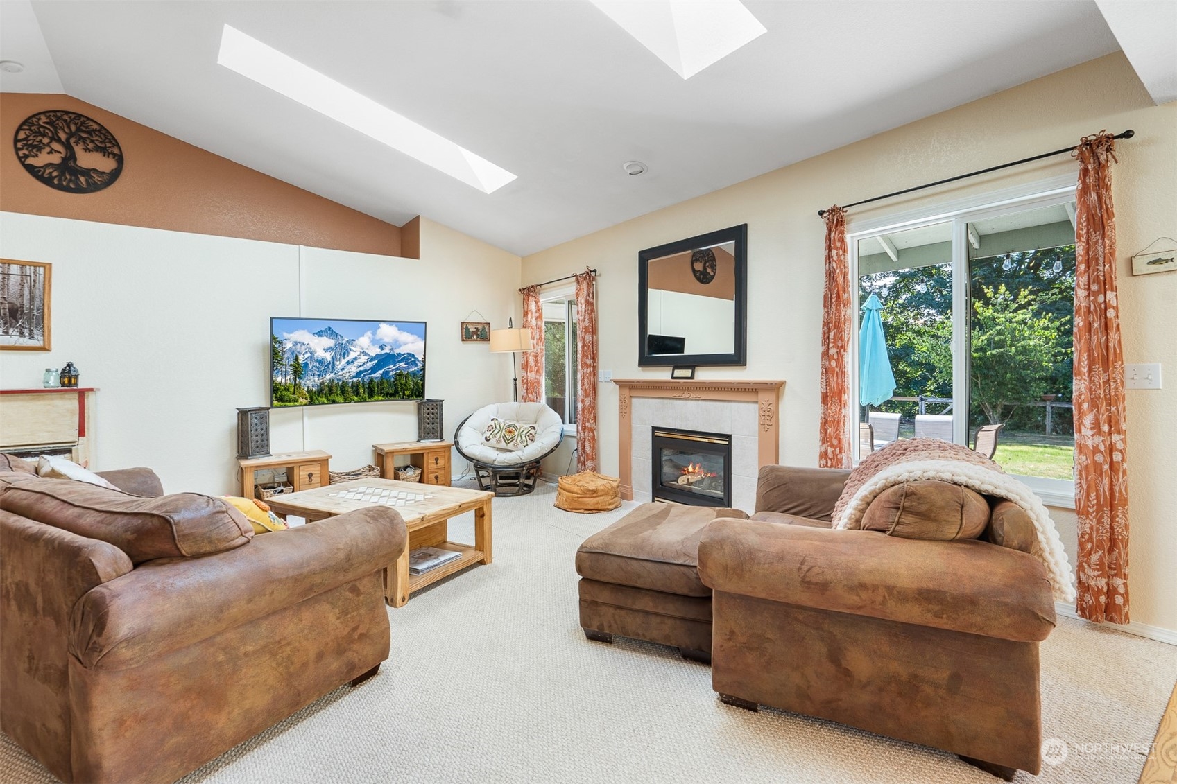 1765 53rd Loop Southeast Olympia, WA 98501 - Photo 6 of 34 a living room with furniture a fireplace and a large window