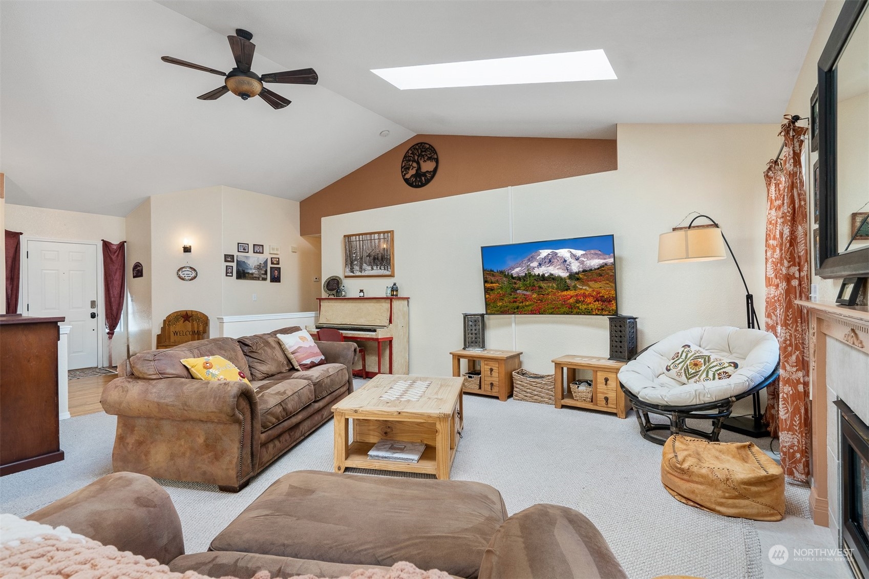 1765 53rd Loop Southeast Olympia, WA 98501 - Photo 7 of 34 a living room with furniture a rug and a flat screen tv