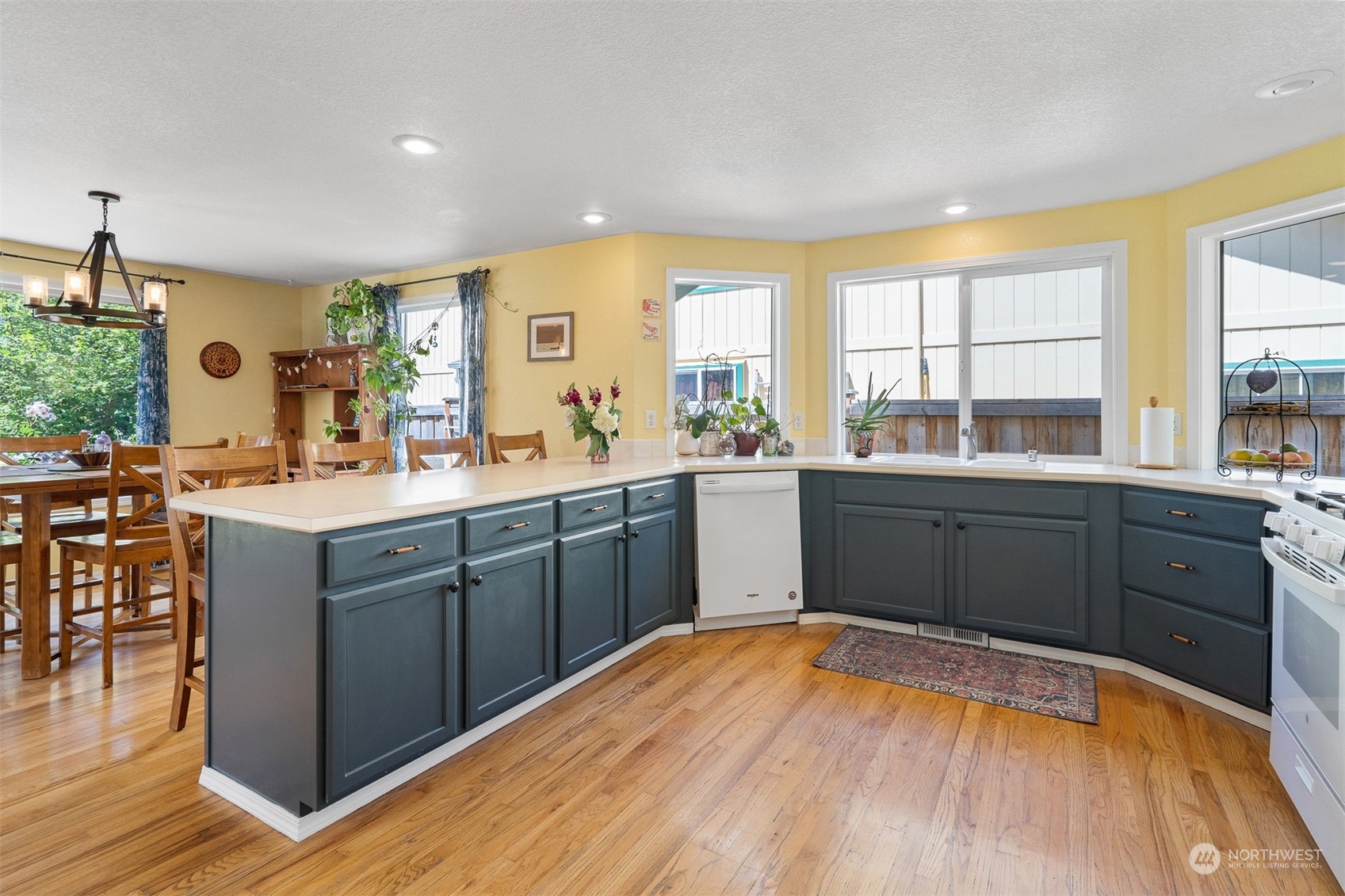1765 53rd Loop Southeast Olympia, WA 98501 - Photo 10 of 34 a kitchen with a sink stove and cabinets