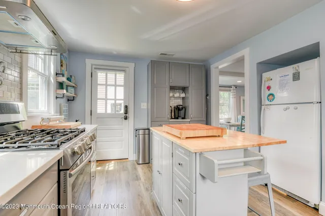 a kitchen with a stove a refrigerator and a stove