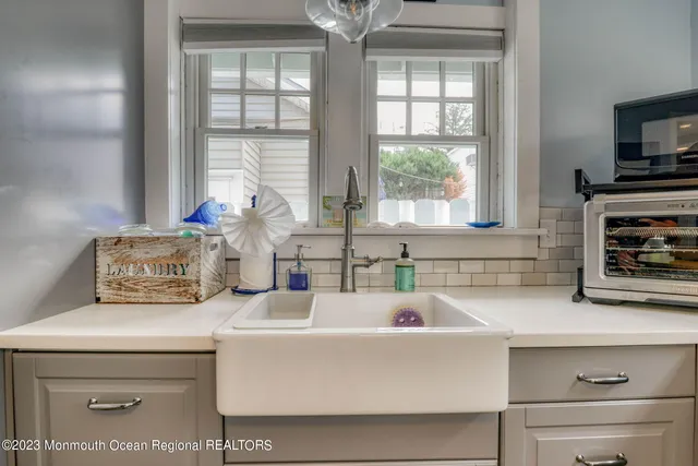 a kitchen with a sink and a window