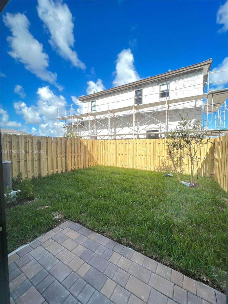 12765 Southwest 234th Terrace Homestead, FL 33032 - Photo 12 of 28 a view of a swimming pool with a garden