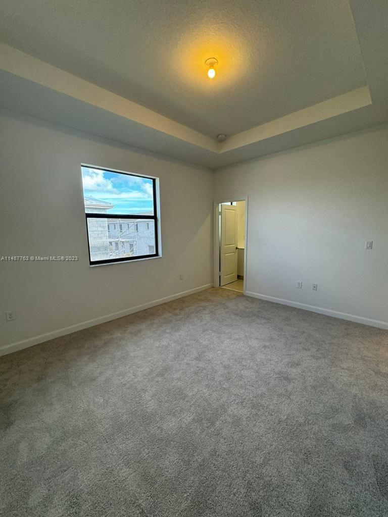 12765 Southwest 234th Terrace Homestead, FL 33032 - Photo 17 of 28 an empty room with windows and closet