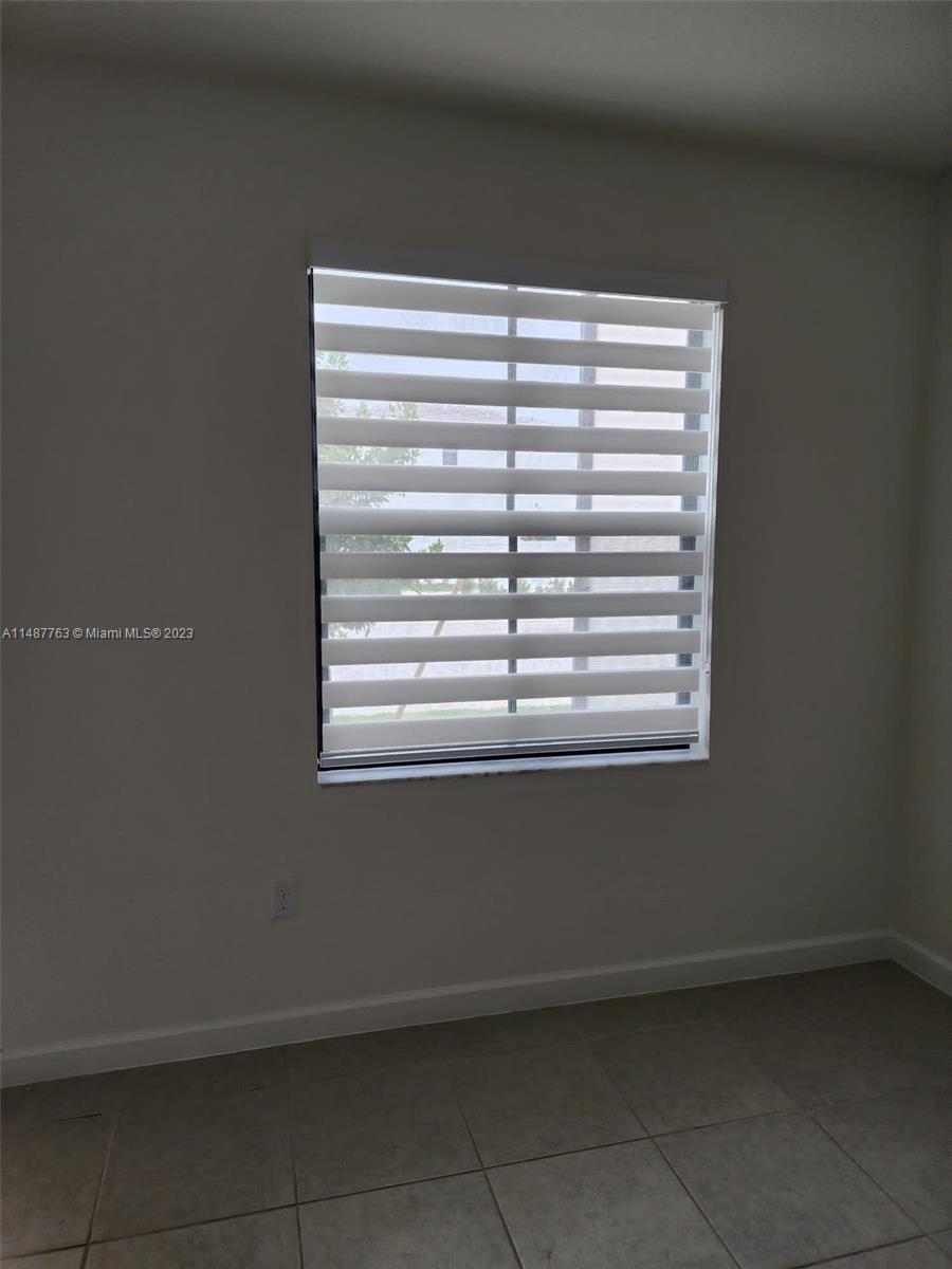 12765 Southwest 234th Terrace Homestead, FL 33032 - Photo 20 of 28 a view of empty room with a window