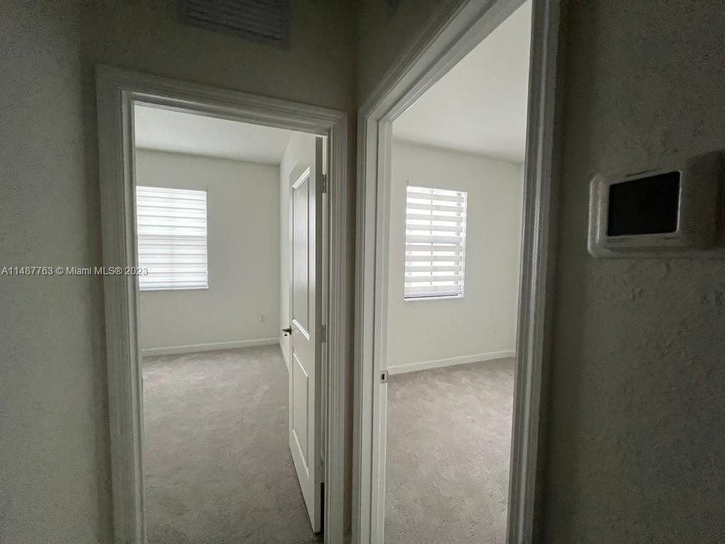 12765 Southwest 234th Terrace Homestead, FL 33032 - Photo 24 of 28 a view of an empty room with closet and a mirror