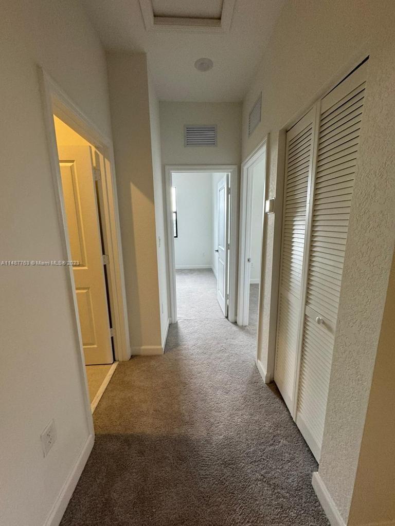 12765 Southwest 234th Terrace Homestead, FL 33032 - Photo 25 of 28 an empty room with windows
