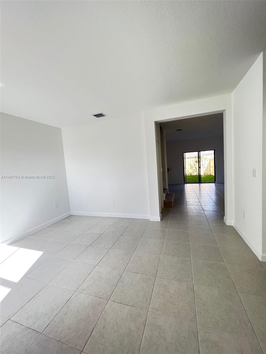 12765 Southwest 234th Terrace Homestead, FL 33032 - Photo 4 of 28 a view of an empty room and window