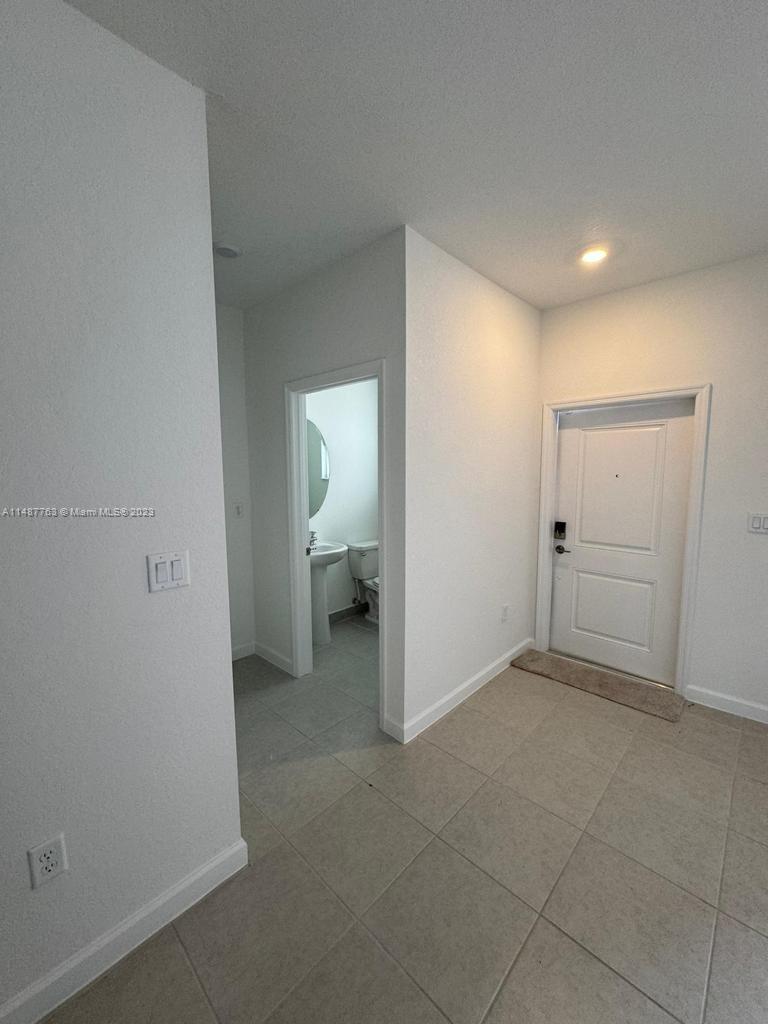 12765 Southwest 234th Terrace Homestead, FL 33032 - Photo 6 of 28 a view of a storage & utility room with a sink