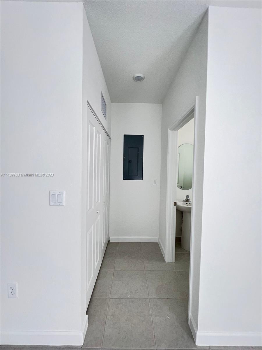 12765 Southwest 234th Terrace Homestead, FL 33032 - Photo 7 of 28 a view of a livingroom with a hallway