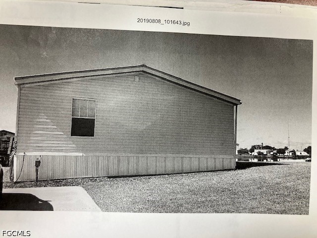1982 Joshua Boulevard Clewiston, FL 33440 - Photo 3 of 5 a bathroom with a sink and a mirror