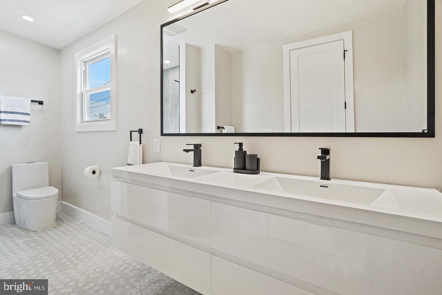 719 Quebec Place Northwest Washington, DC 20010 - Photo 17 of 32 Sleek modern bathroom with elegant finishes.