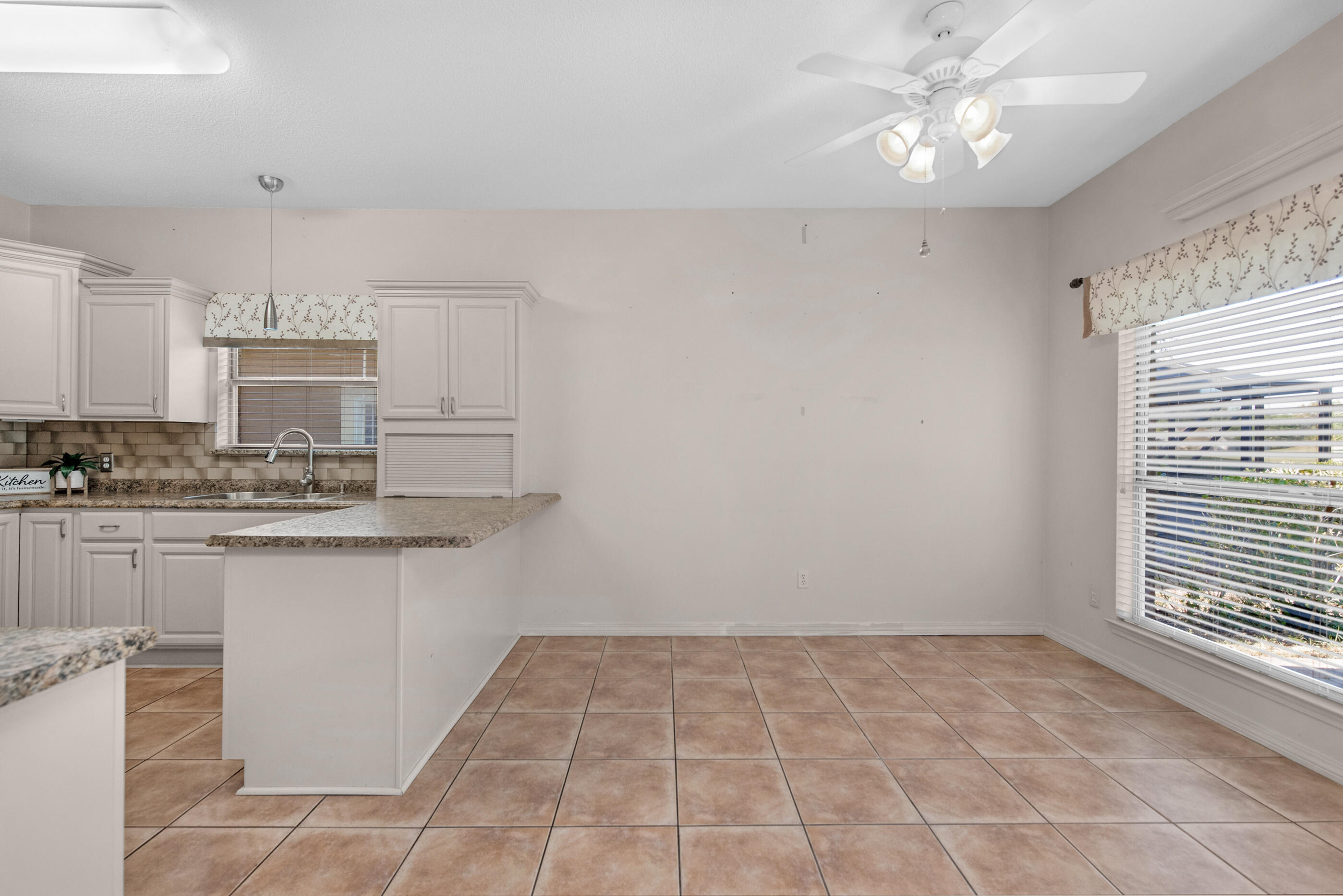 924 Shalimar Point Drive Shalimar, FL 32579 - Photo 11 of 40 a view of kitchen with granite countertop cabinets and window
