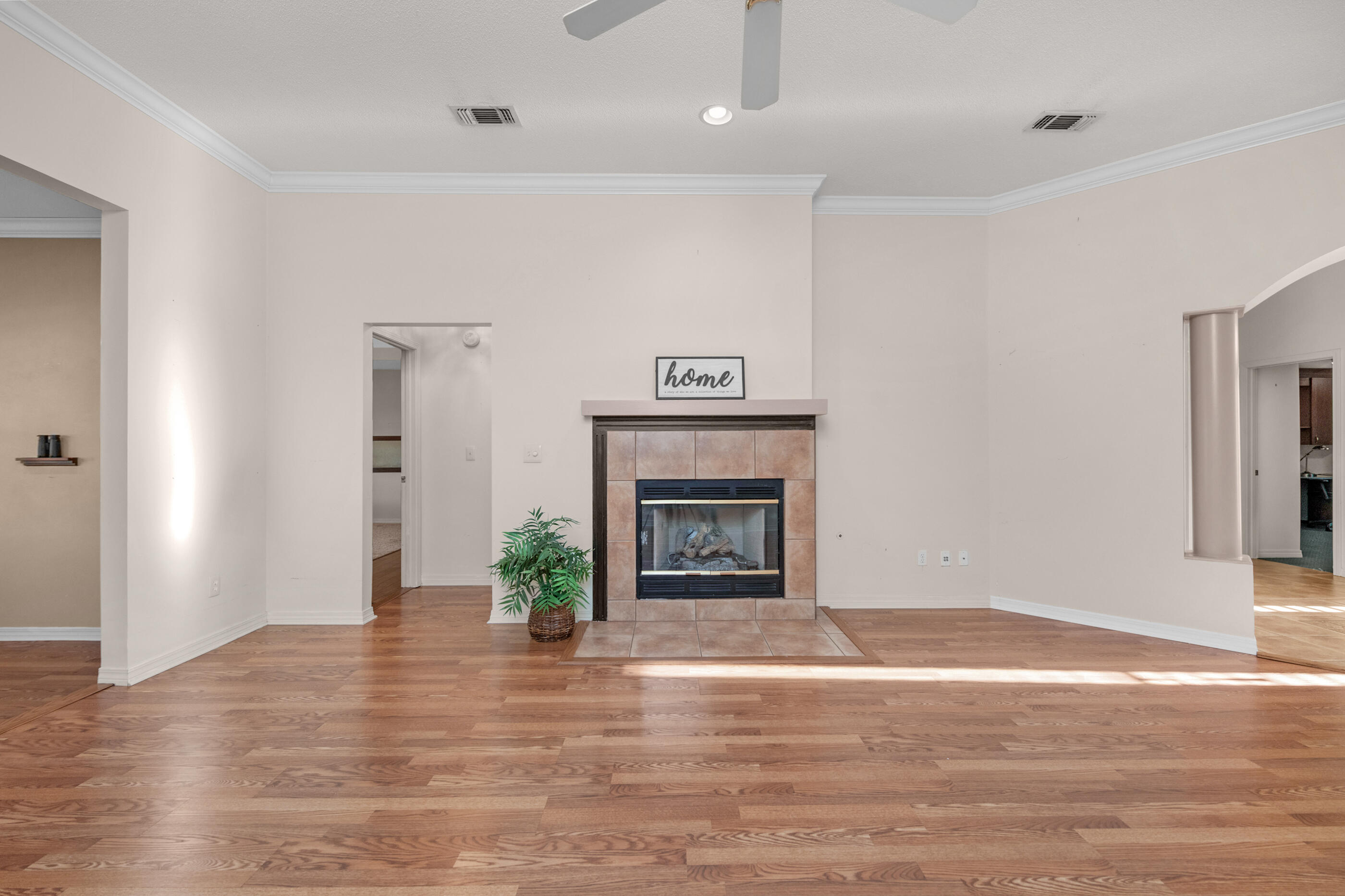 924 Shalimar Point Drive Shalimar, FL 32579 - Photo 13 of 40 a view of an empty room with wooden floor fireplace and a window
