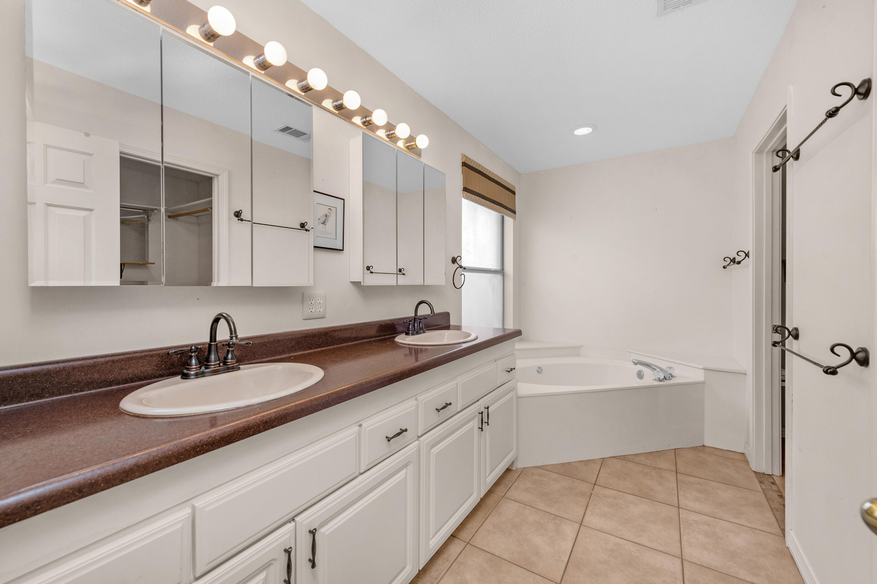 924 Shalimar Point Drive Shalimar, FL 32579 - Photo 18 of 40 a bathroom with a sink double vanity granite tub and a mirror