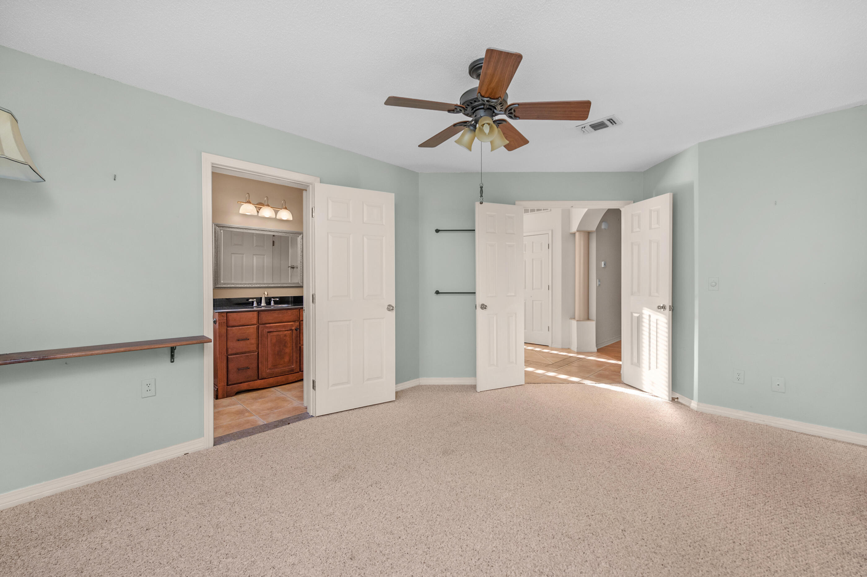 924 Shalimar Point Drive Shalimar, FL 32579 - Photo 26 of 40 a view of a livingroom with a ceiling fan & entryway