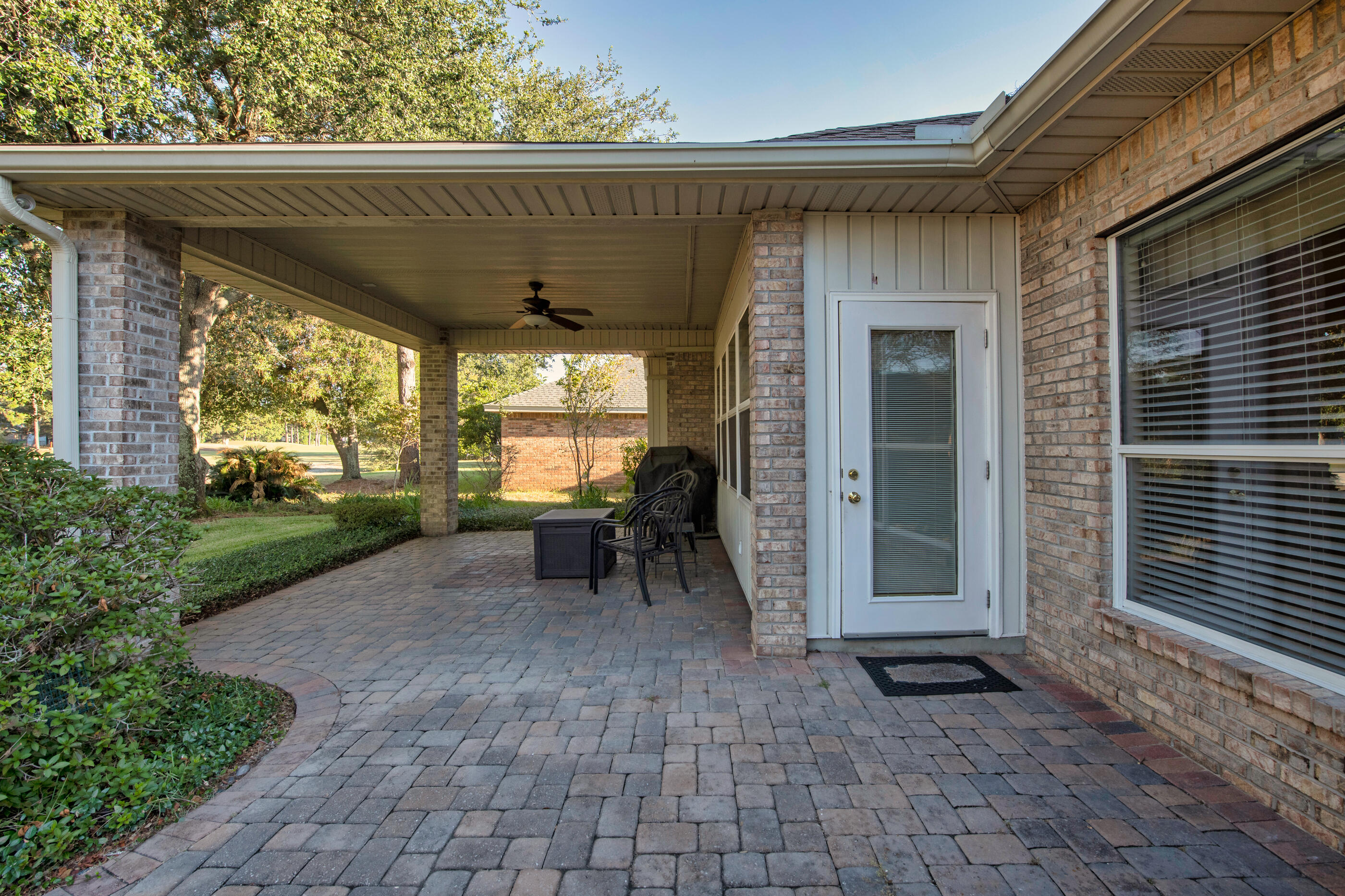 924 Shalimar Point Drive Shalimar, FL 32579 - Photo 33 of 40 a view of a chairs and table in the patio