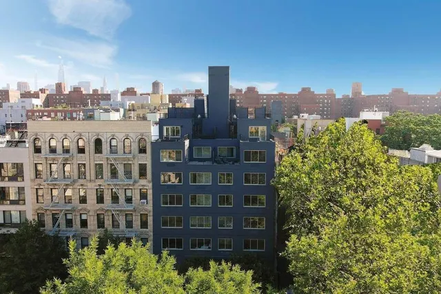 a view of a city with tall buildings