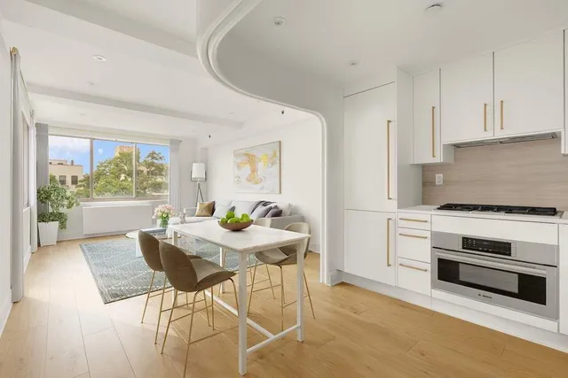 a view of a kitchen and dining room