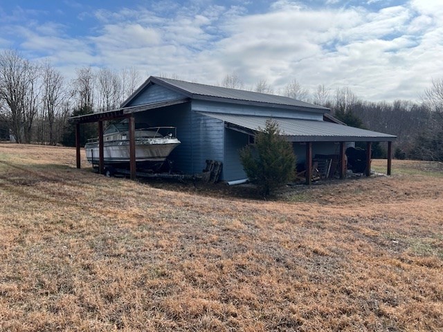 2340 Turkey Town Road Hilham, TN 38568 - Photo 2 of 19 a view of a house with a yard and garage