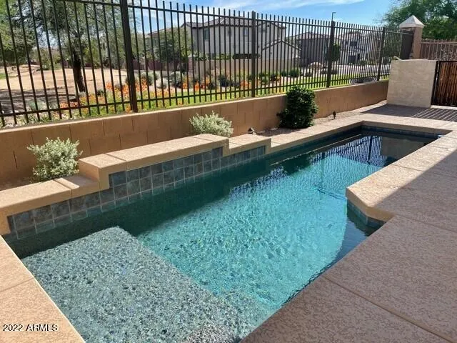 a view of swimming pool from a balcony