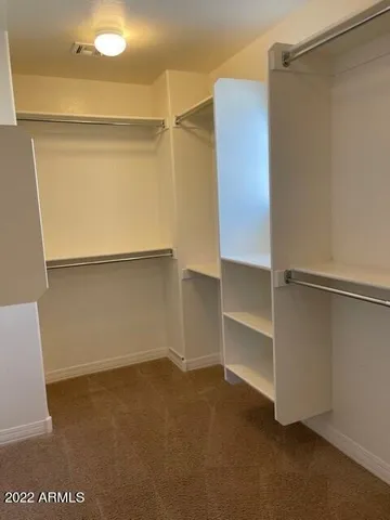 a view of an empty walk in closet