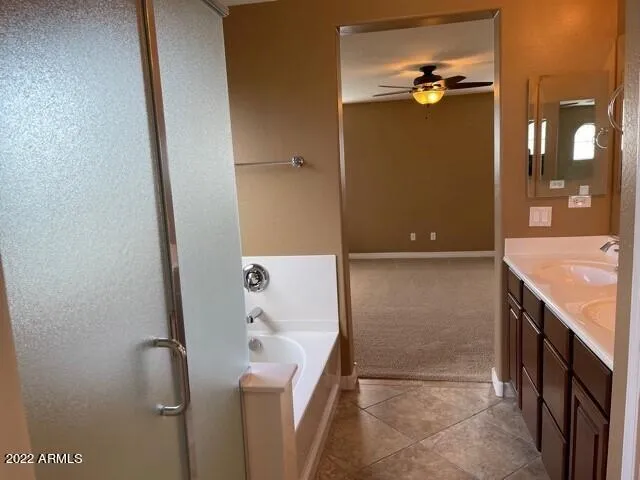 a bathroom with a shower and a sink