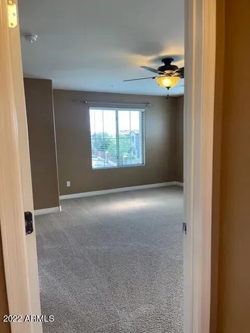 a view of an empty room with a window