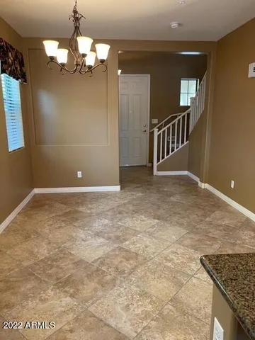 wooden floor in a hall with a window