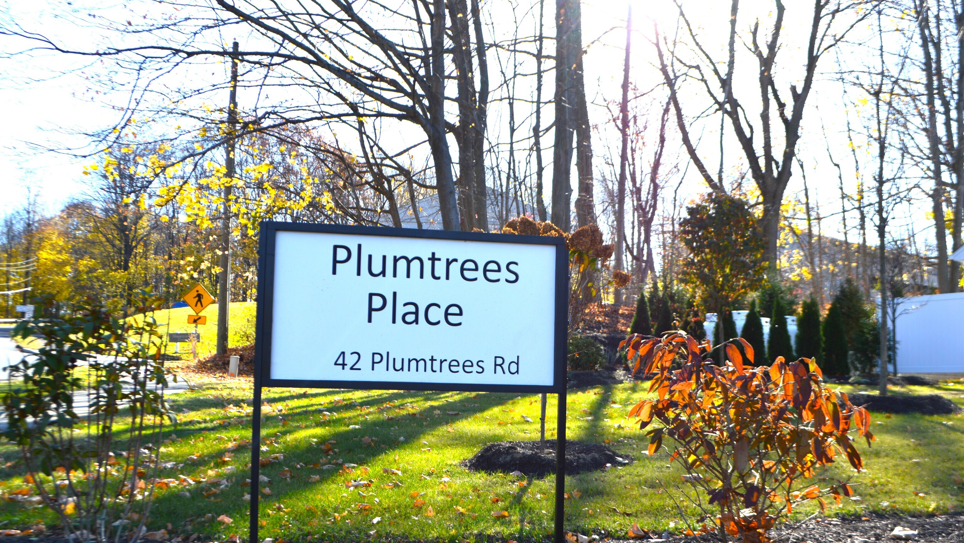 42 Plumtrees Road, Unit 9 Bethel, CT 06801 - Photo 1 of 1 a sign on the wall of a building