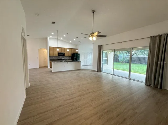 a view of a kitchen with a sink and a stove top oven