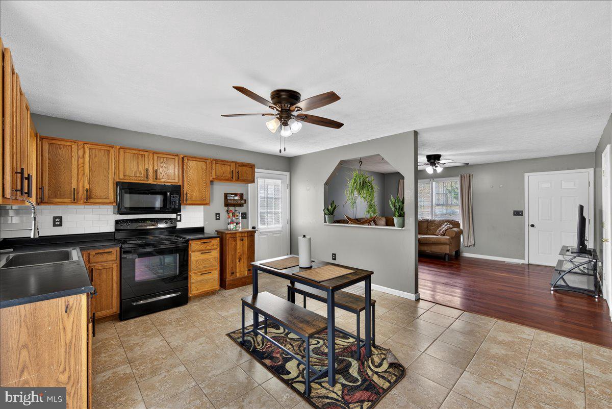 6265 Browning Road Culpeper, VA 22701 - Photo 11 of 74 a living room with furniture and a wooden floor