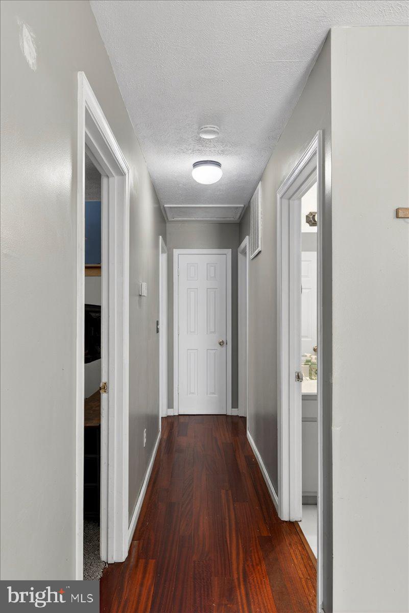 6265 Browning Road Culpeper, VA 22701 - Photo 18 of 74 a view of a hallway with wooden floor