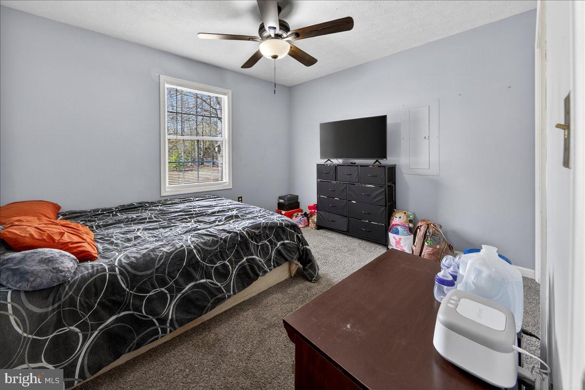 6265 Browning Road Culpeper, VA 22701 - Photo 29 of 74 a bedroom with a bed and a flat screen tv
