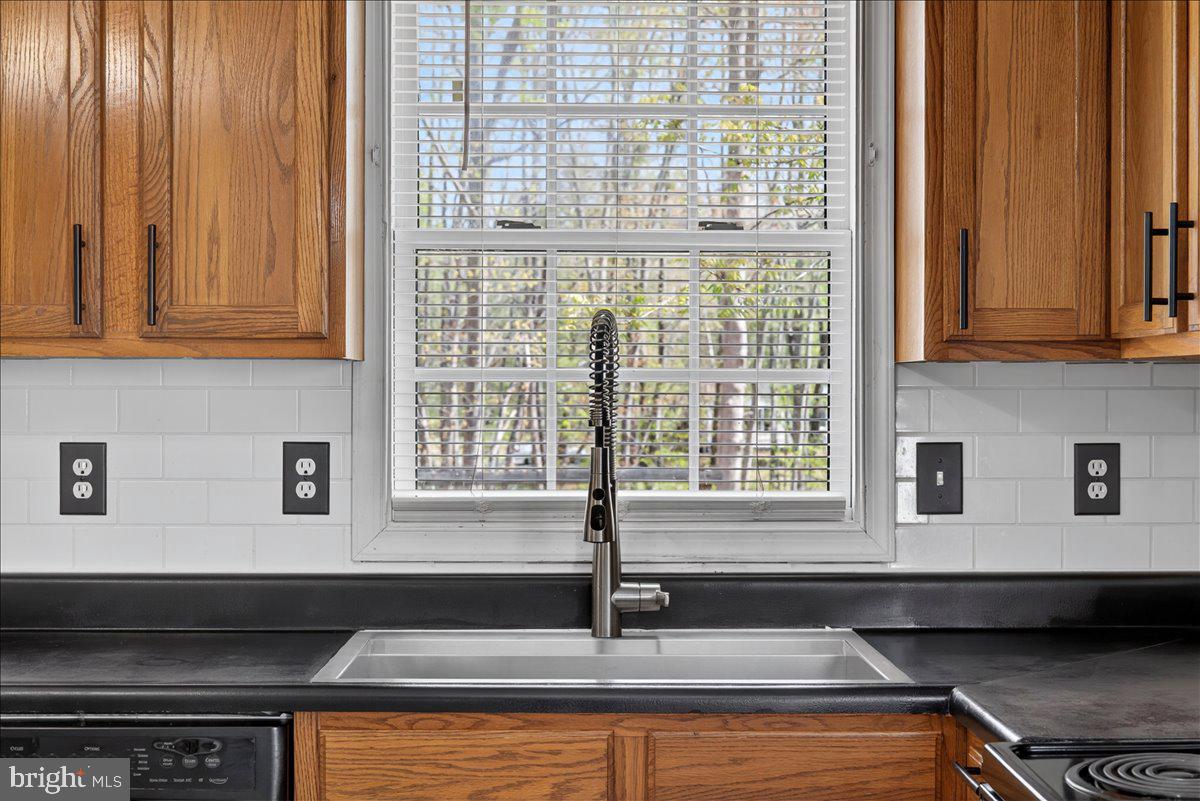 6265 Browning Road Culpeper, VA 22701 - Photo 33 of 74 a kitchen with granite countertop a sink and a window